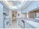 Efficient kitchen with white appliances, ample counter space, and a sunlit ceiling for a bright cooking experience at 4368 Las Palmas Ave, Spring Hill, FL 34606