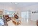 Bright living room with hardwood floors, comfortable seating, and sliding glass doors at 4368 Las Palmas Ave, Spring Hill, FL 34606
