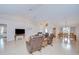 Inviting living room with hardwood floors, vaulted ceilings, and an open layout to other living spaces at 4368 Las Palmas Ave, Spring Hill, FL 34606