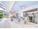 An inviting covered patio with ceiling fans, comfortable seating, and easy access to the screened-in pool at 4368 Las Palmas Ave, Spring Hill, FL 34606