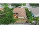 House features screened-in patio with mature landscaping and backyard at 4418 River Overlook Dr, Valrico, FL 33596