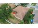 The roof of the house featuring a screened-in patio and backyard at 4418 River Overlook Dr, Valrico, FL 33596