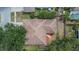 Aerial view of the home showing the roof and small garden at 4418 River Overlook Dr, Valrico, FL 33596