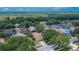 Aerial view of a residential neighborhood with lush trees and multiple homes at 4418 River Overlook Dr, Valrico, FL 33596