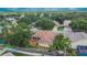 Home featuring a screened-in patio and mature landscaping in the backyard at 4418 River Overlook Dr, Valrico, FL 33596