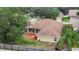 View of the back of the house featuring a screen porch and fenced yard at 4418 River Overlook Dr, Valrico, FL 33596