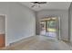 Bright bedroom featuring a ceiling fan, plush carpet, and sliding glass doors to the backyard at 4418 River Overlook Dr, Valrico, FL 33596