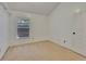 Neutral bedroom with vaulted ceilings and a window at 4418 River Overlook Dr, Valrico, FL 33596