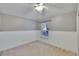 Neutral bedroom featuring carpet floors, wainscoting and a window at 4418 River Overlook Dr, Valrico, FL 33596