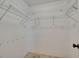 Walk-in closet featuring wire shelving and neutral colored carpet at 4418 River Overlook Dr, Valrico, FL 33596
