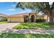 Charming single-story home with a well-manicured lawn and a two car garage at 4418 River Overlook Dr, Valrico, FL 33596
