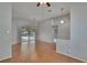 Spacious living room with wood floors, neutral paint and slider access to the screened lanai at 4418 River Overlook Dr, Valrico, FL 33596