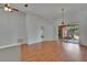 Spacious living room with wood floors, neutral paint and chandelier lighting at 4418 River Overlook Dr, Valrico, FL 33596