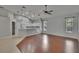 Bright living room with hardwood floors, neutral walls, pendant lights and vaulted ceilings at 4418 River Overlook Dr, Valrico, FL 33596