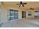 Spacious screened patio with ceiling fans and views of the backyard at 4418 River Overlook Dr, Valrico, FL 33596