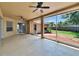 Spacious screened patio with ceiling fans and views of the backyard at 4418 River Overlook Dr, Valrico, FL 33596