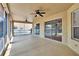 Spacious screened patio with ceiling fans and views of the backyard at 4418 River Overlook Dr, Valrico, FL 33596