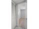 Bright bedroom featuring a closet with white louvered doors and light wood floors at 500 New York Ave # 23, Dunedin, FL 34698