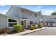 Well-manicured townhome with neutral siding, large windows, and mature landscaping at 500 New York Ave # 23, Dunedin, FL 34698