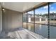 Screened-in lanai overlooking a pond and other homes at 500 New York Ave # 23, Dunedin, FL 34698