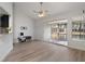 Bright living room with water views and access to a screened patio, perfect for relaxation at 500 New York Ave # 23, Dunedin, FL 34698