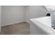 Neutral loft featuring railing overlooking below and closet with louvered doors at 500 New York Ave # 23, Dunedin, FL 34698