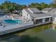 Exterior view of the pool area and outdoor seating near the water at 500 New York Ave # 23, Dunedin, FL 34698