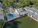 Exterior view of the pool with a view of the waterfront at 500 New York Ave # 23, Dunedin, FL 34698