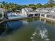 Exterior view of the property overlooking the water with a community pool at 500 New York Ave # 23, Dunedin, FL 34698