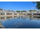 Scenic waterfront view of condos with a beautiful fountain in the pond at 500 New York Ave # 23, Dunedin, FL 34698