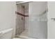 Bathroom with tiled shower and sliding glass door at 5052 Sunridge Palms Dr # 102, Tampa, FL 33617
