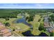 Scenic aerial view showcases the community golf course and lush green landscaping at 5160 Loquat Ct, Palm Harbor, FL 34685