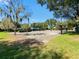 Community basketball court for sports and recreation, surrounded by trees at 5160 Loquat Ct, Palm Harbor, FL 34685