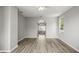 Large bedroom with hard wood floors and arched entrance to ensuite bathroom at 5160 Loquat Ct, Palm Harbor, FL 34685