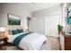 Staged bedroom featuring a plush bed, contemporary decor, and ample closet space for a serene retreat at 5160 Loquat Ct, Palm Harbor, FL 34685