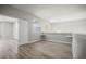 Bright bonus room featuring wood-look floors, natural light, and an adjacent area for versatile use at 5160 Loquat Ct, Palm Harbor, FL 34685