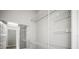 Walk-in closet provides ample storage space with wire shelving and a full length mirror at 5160 Loquat Ct, Palm Harbor, FL 34685