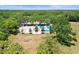 Overhead view featuring a community park with tennis courts, a volleyball court, and recreational fields at 5160 Loquat Ct, Palm Harbor, FL 34685