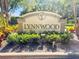 Community entrance to Lynnwood with attractive signage and colorful landscaping at 5160 Loquat Ct, Palm Harbor, FL 34685
