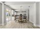 Dining area near the kitchen with a chandelier and views of the backyard at 5160 Loquat Ct, Palm Harbor, FL 34685
