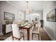 Formal dining room with chandelier and neutral décor at 5160 Loquat Ct, Palm Harbor, FL 34685