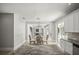 Dining room with a wooden table and chairs, seamlessly connecting the kitchen and Gathering room for flexible entertaining at 5160 Loquat Ct, Palm Harbor, FL 34685