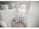 Spacious foyer featuring a chandelier and double doors at 5160 Loquat Ct, Palm Harbor, FL 34685