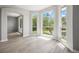 Light-filled living room with large windows providing serene views of the backyard at 5160 Loquat Ct, Palm Harbor, FL 34685