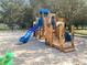 Fun community playground with a blue slide and natural wooden play structure at 5160 Loquat Ct, Palm Harbor, FL 34685