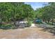 Community playground featuring various play structures and a soccer net in a shaded, grassy area at 5160 Loquat Ct, Palm Harbor, FL 34685