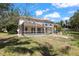 Enjoy the outdoors in the screened pool with a backyard oasis, perfect for relaxation at 5160 Loquat Ct, Palm Harbor, FL 34685