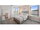 Cozy bedroom with a soft color palette, plush bedding, and abundant natural light at 5634 Clearwater Ct, Lakewood Ranch, FL 34211