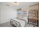 Inviting bedroom features a desk, neutral decor, and ample natural light at 5634 Clearwater Ct, Lakewood Ranch, FL 34211