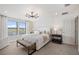 A serene bedroom boasts natural light, plush carpeting, and stylish fixtures and decor at 5634 Clearwater Ct, Lakewood Ranch, FL 34211